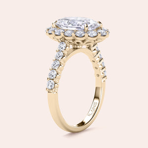 Elegant oval diamond engagement ring in halo setting with side stones, available in 14K, 18K gold, or platinum. Close-up view.