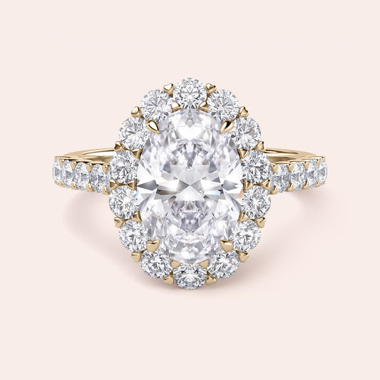 Elegant oval diamond ring with a stunning oval diamond center, set in 14K or 18K gold or platinum, complete with a diamond halo.
