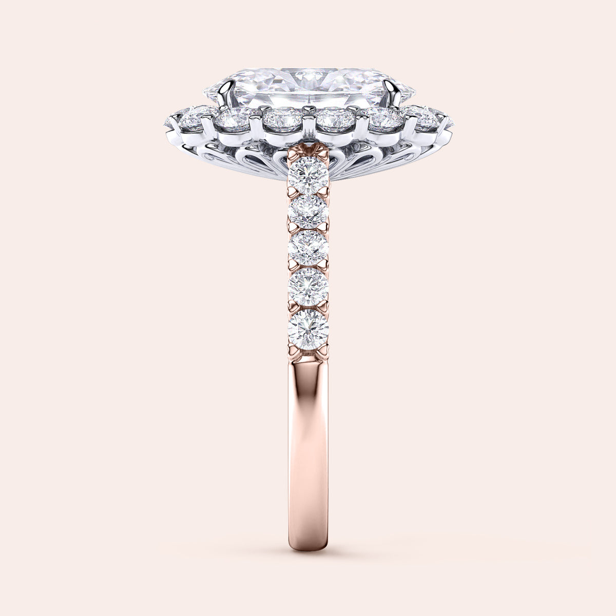 Two-tone 14K rose and white gold oval diamond ring with halo and pave band, perfect for engagement or weddings. 