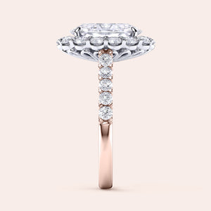 Two-tone 14K rose and white gold oval diamond ring with halo and pave band, perfect for engagement or weddings. 