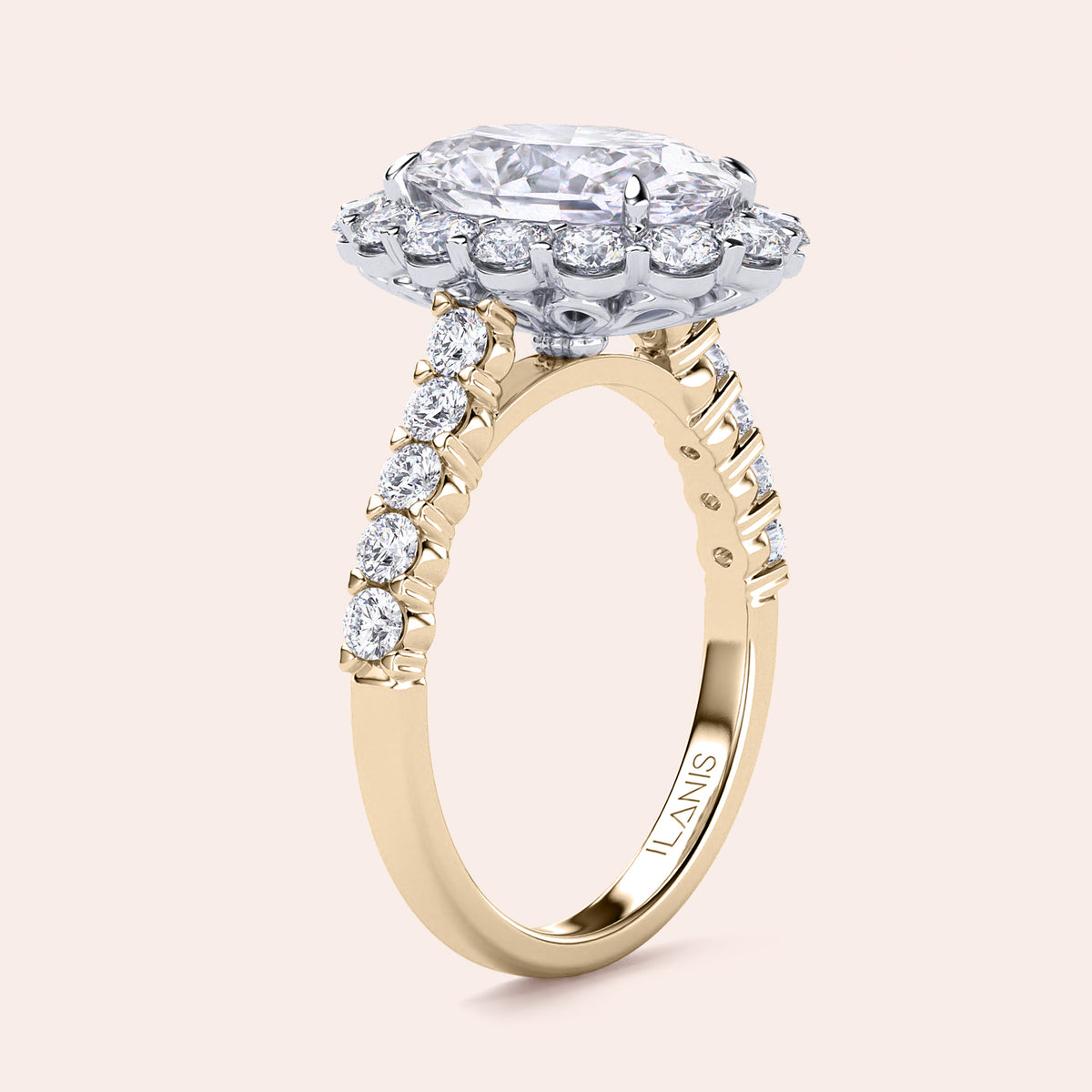 Two-tone 18K oval diamond engagement ring with halo and pave band in yellow and white gold, showcasing exquisite craftsmanship. 