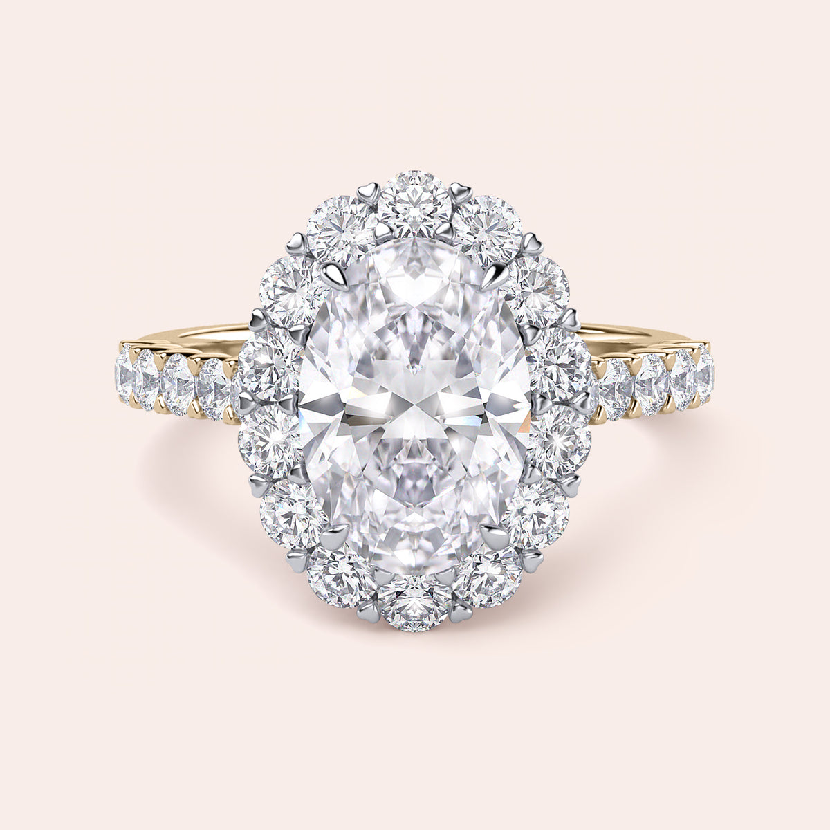 Two-tone 14K white and yellow gold engagement ring featuring an oval diamond, halo, and pave diamond band, unworn. 
