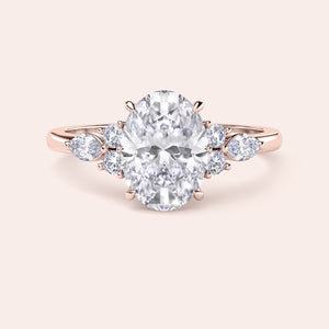 Elegant oval diamond engagement ring in 14K or 18K gold or platinum, featuring side stones for a sophisticated look. Not worn on model.