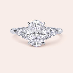 Elegant oval-shaped diamond engagement ring in polished 14K, 18K, or platinum band with stunning center diamond and side stones.
