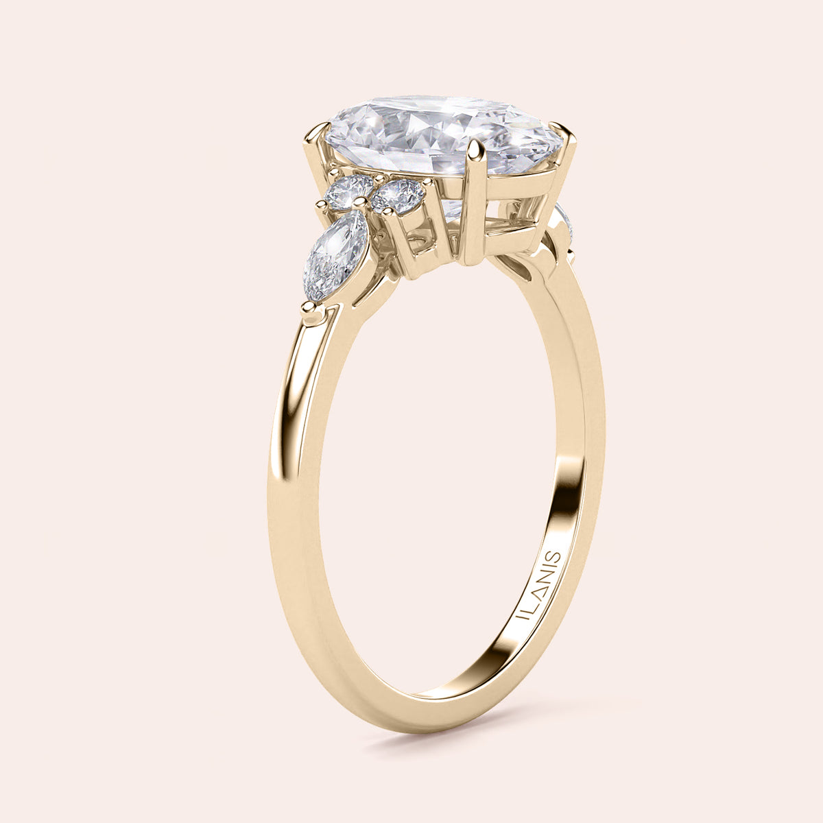 Gold engagement ring with oval-shaped diamond and marquise accents, available in 14K, 18K, or platinum for stunning elegance.