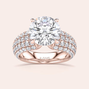 Elegant rose gold ring with a round-cut diamond and pave band, available in 14K, 18K, or platinum. Perfect for any occasion.