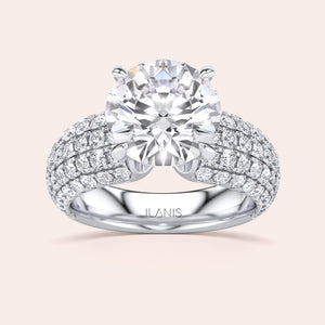 Stunning oval diamond ring in 14K or 18K gold or platinum with a dazzling array of smaller diamonds, elegant and sophisticated.