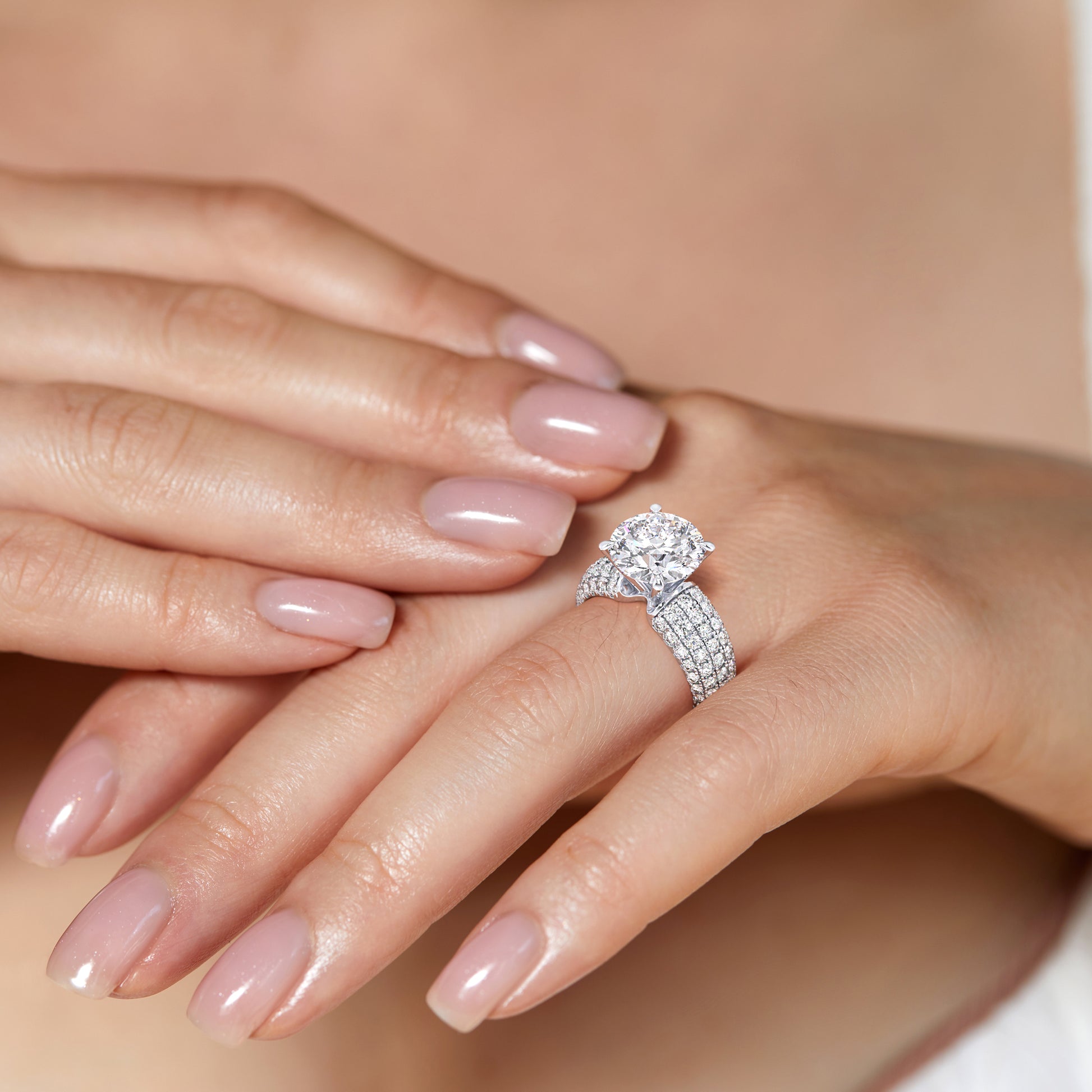 Stunning 14K/18K gold engagement ring with radiant cut diamond and intricate detailing, showcasing elegance on a model's hand.|

#14KRecycledWhiteGold
#18KRecycledWhiteGold
#Platinum






