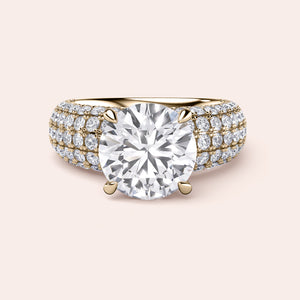 Luxurious 14K and 18K gold engagement ring with a large round diamond and three rows of smaller diamonds on a wide band.