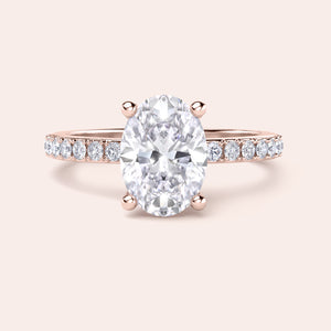 Elegant oval diamond solitaire engagement ring with pavé band in 14K or 18K gold, or platinum, beautifully crafted and unmodelled.