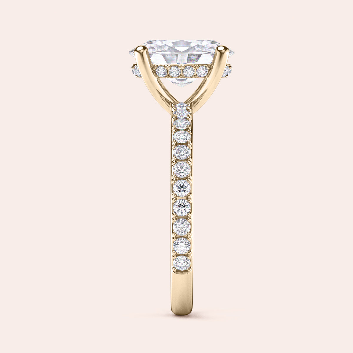 Elegant engagement ring in 14K yellow gold, featuring a cushion-cut diamond and pavé band for extra sparkle.