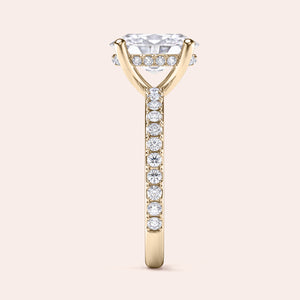 Elegant engagement ring in 14K yellow gold, featuring a cushion-cut diamond and pavé band for extra sparkle.