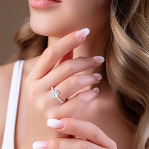 Sparkling cushion-cut diamond engagement ring in 14K, 18K gold, or platinum, elegantly worn, highlighting its brilliance and design.