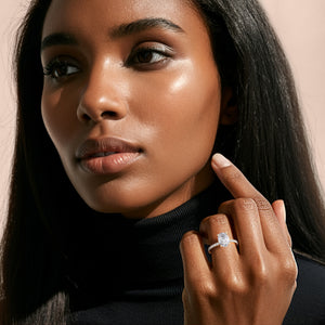 Oval diamond engagement ring in 14K or 18K gold, or platinum, beautifully showcased on a model's finger.