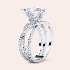 Elegant three-band ring set in 14K/18K gold or platinum, adorned with a heart-shaped diamond and smaller accent diamonds. Perfect for special occasions.