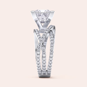 Elegant princess cut diamond ring in crisscross band, available in 14K, 18K, and platinum, adorned with sparkling stones.