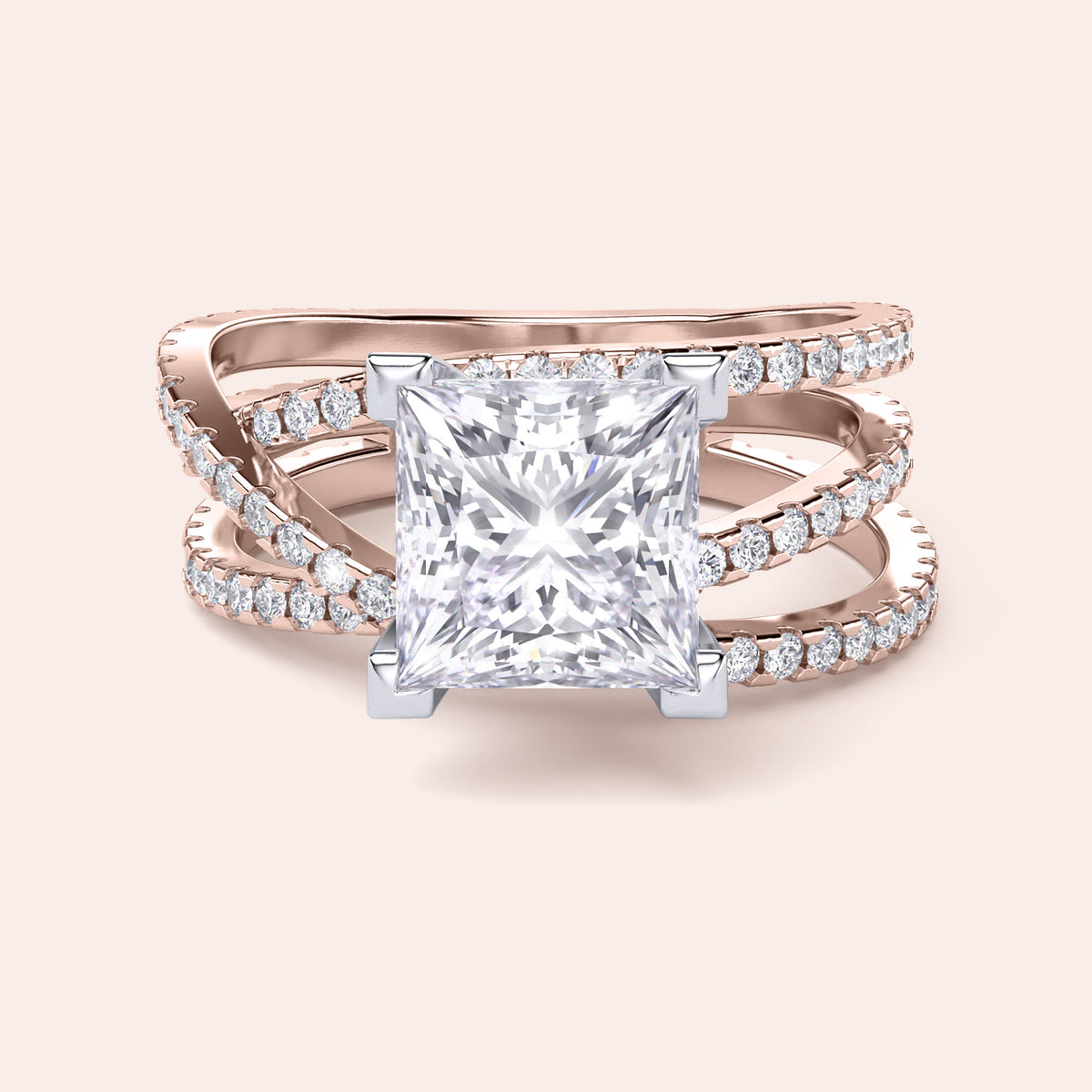 Two-tone 14K rose and white gold engagement ring featuring a princess-cut diamond and swirl pave band design. 