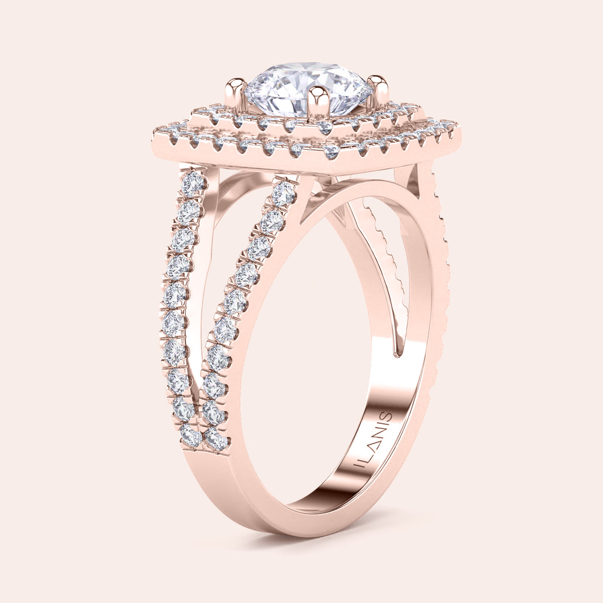 Elegant diamond halo ring in rose gold, featuring a cushion-cut diamond and split shank design. Available in 14K, 18K, or platinum.