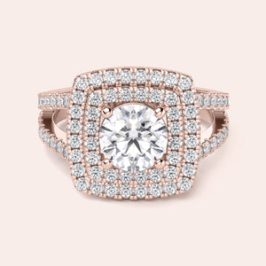 Elegant cushion-cut diamond engagement ring in 14K, 18K, or platinum with a dazzling halo design, worn by a model.