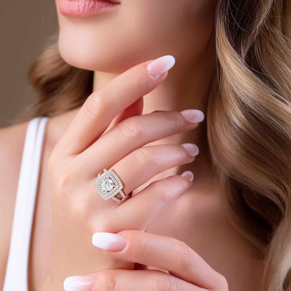 Stunning square diamond ring in 14K or 18K gold or platinum, elegantly accentuating the model's style.