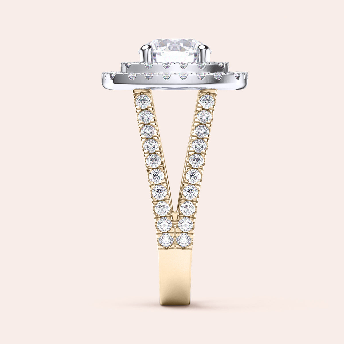 Two-tone 14K round diamond ring in yellow and white gold, featuring a double halo and split shank design, showcased on a model's hand. 