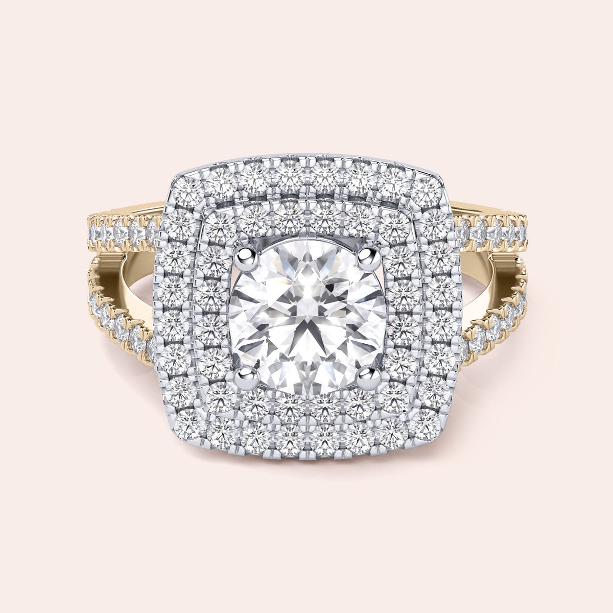 Two-tone 14K gold engagement ring with round diamond, double halo, and split shank design in white and yellow gold. 