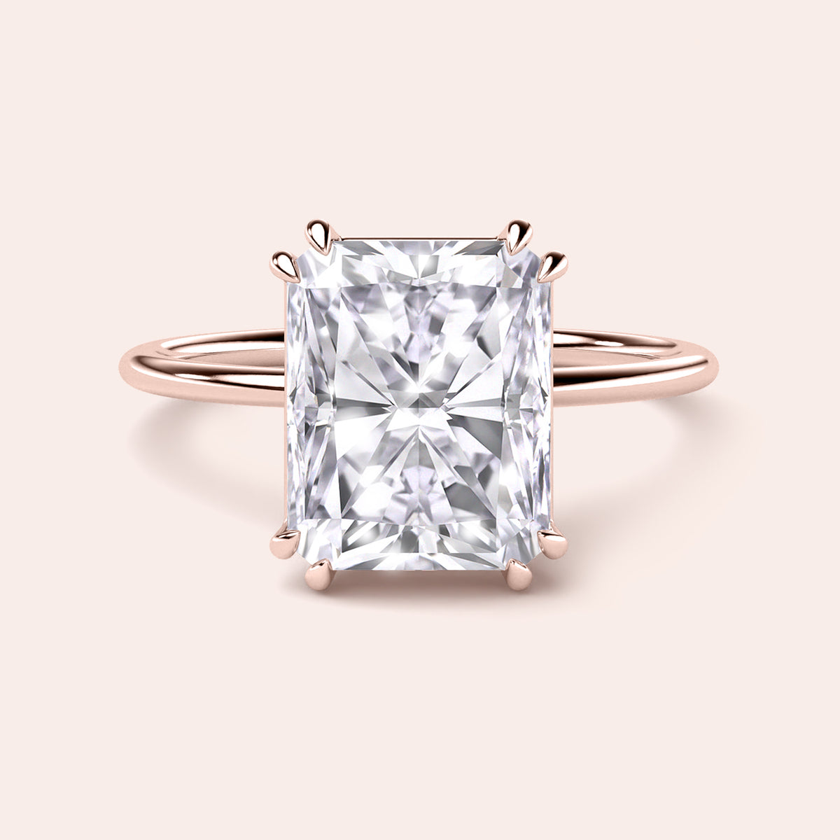 Radiant cut diamond ring set in 14K gold, featuring exquisite design and sparkle for ultimate elegance.