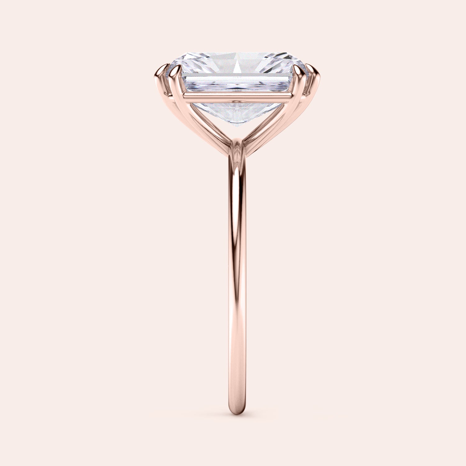 Baguette-cut diamond solitaire ring in rose gold, available in 14K, 18K, or platinum, highlighted in a side profile view.|



#14KRecycledRoseGold
#18KRecycledRoseGold

