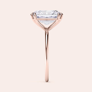 Baguette-cut diamond solitaire ring in rose gold, available in 14K, 18K, or platinum, highlighted in a side profile view.
