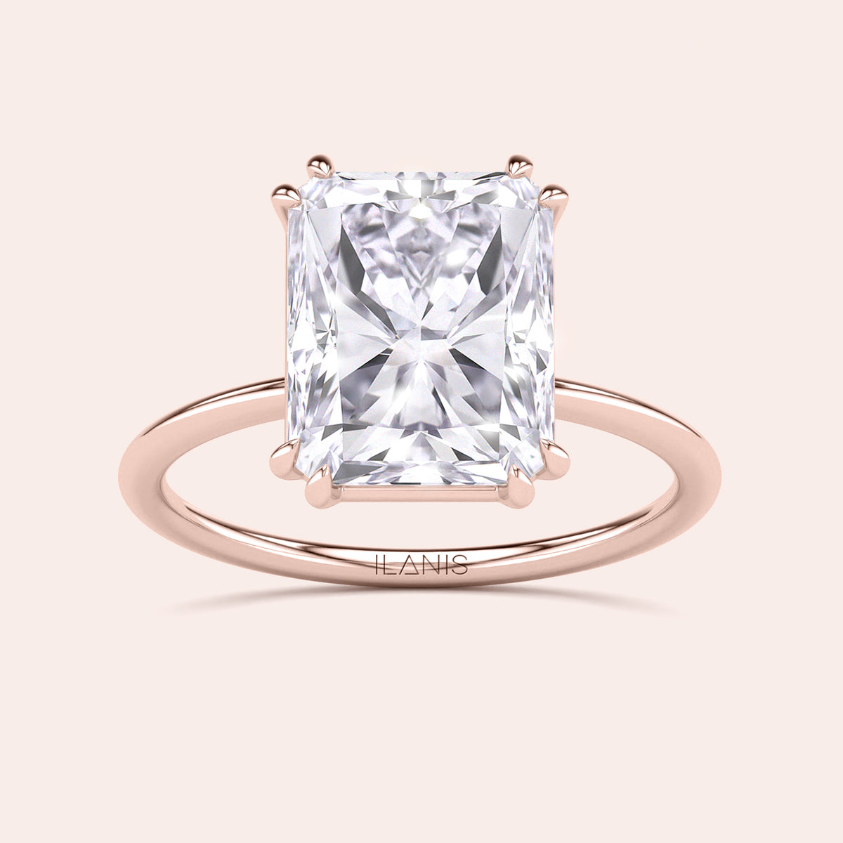 Elegant solitaire ring with a radiant cut diamond in 14K, 18K gold or platinum, showcasing timeless sophistication and style.