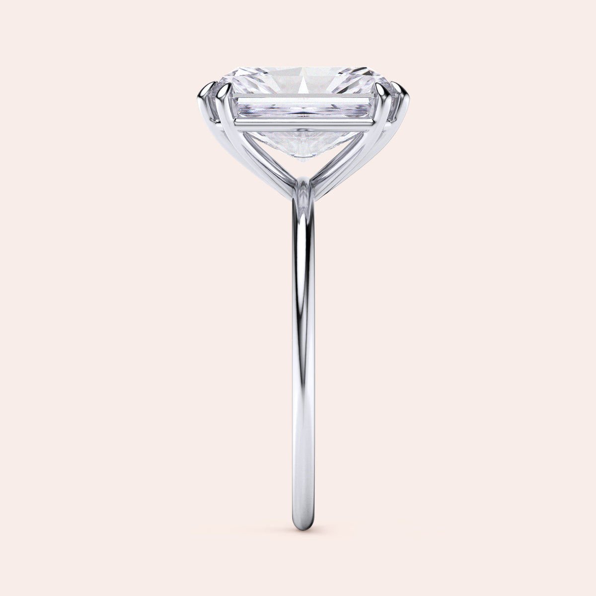 Elegant solitaire engagement ring with a round cut diamond in a sleek band, available in 14K, 18K gold or platinum.  