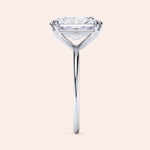 Elegant solitaire engagement ring with a round cut diamond in a sleek band, available in 14K, 18K gold or platinum.  