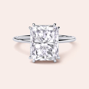 Radiant cut diamond engagement ring in 14K, 18K, or platinum, beautifully showcased for a stunning and elegant choice.