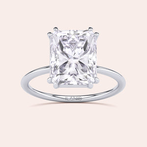 Radiant cut diamond ring in 14K, 18K, or platinum setting, featuring a stunning solitaire design. Not worn on model.