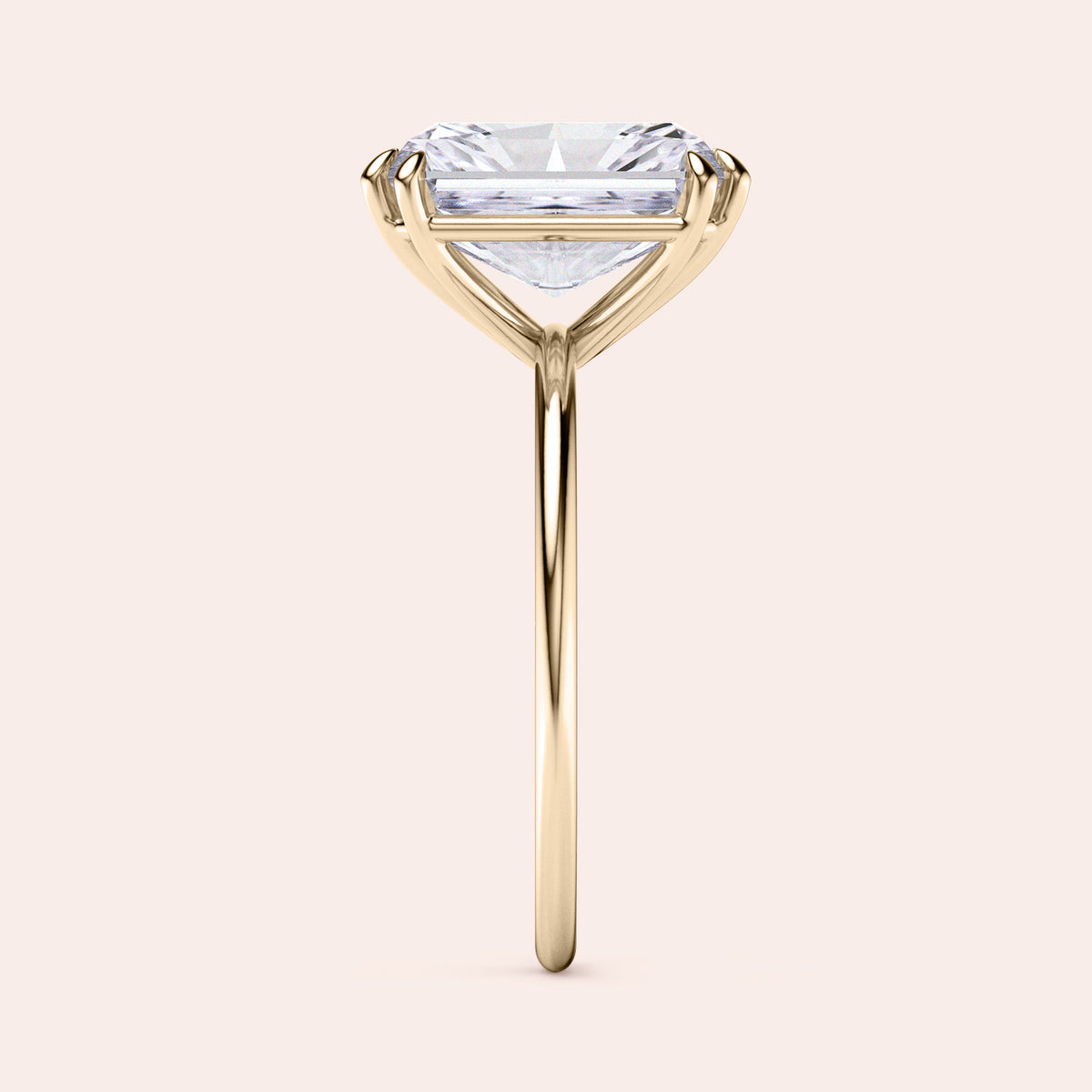 Side view of a solitaire engagement ring with a brilliant 6-prong round diamond, available in 14K, 18K gold or platinum. 