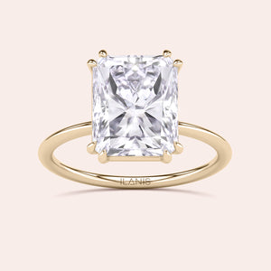 Elegant engagement ring with a radiant-cut diamond in a 14K or 18K yellow gold or platinum band, showcasing brilliance and sophistication.