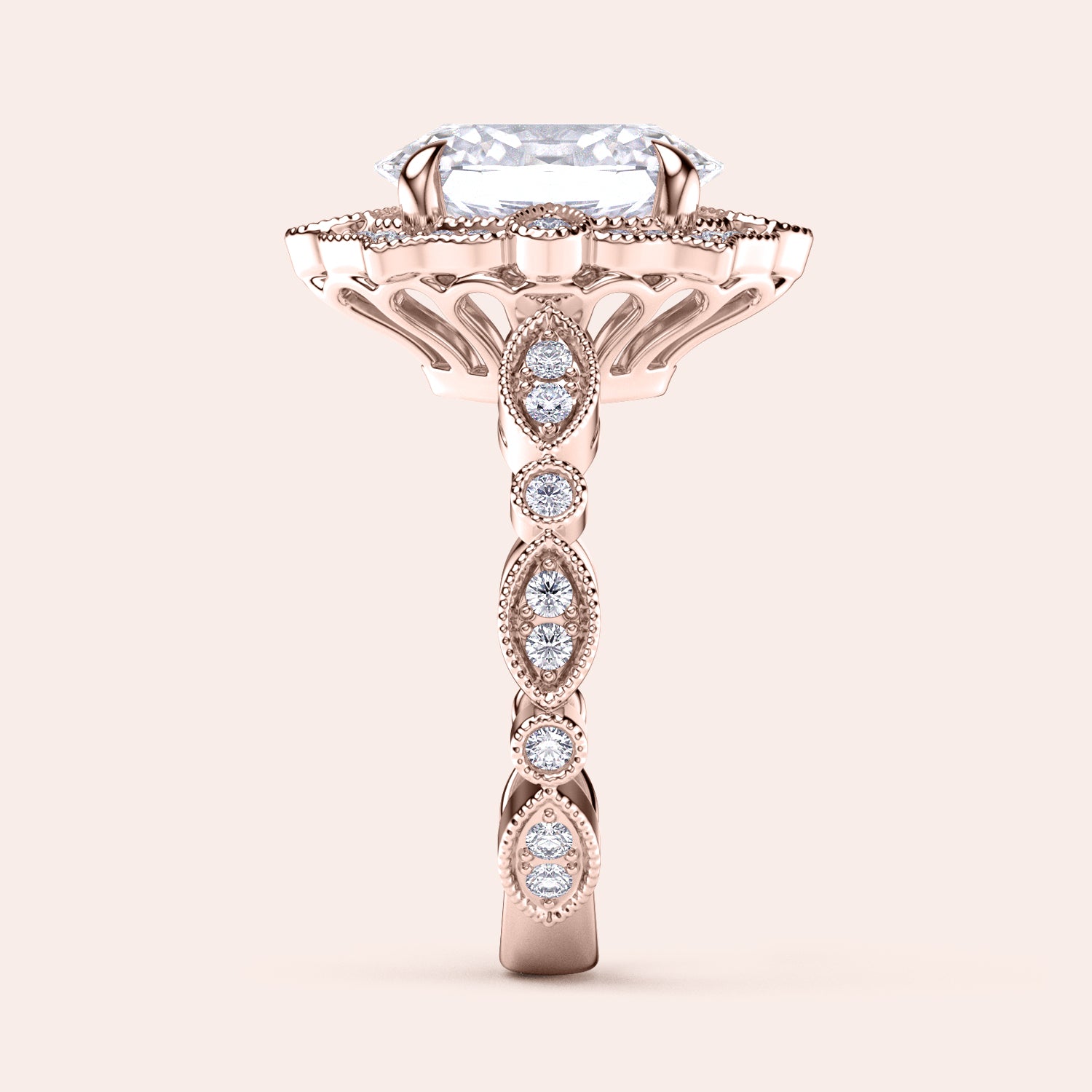 Side view showcasing detailed filigree and diamond accents on vintage oval halo diamond ring in recycled rose gold | #14KRecycledRoseGold #18KRecycledRoseGold