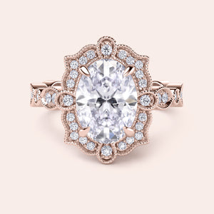 Detailed top view of oval halo vintage-inspired diamond ring set with exquisite filigree in recycled rose gold 