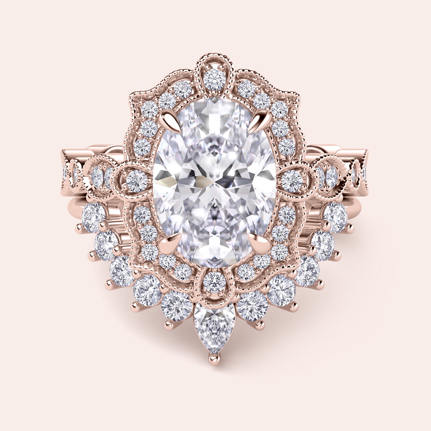 Front detailed view of oval halo diamond ring set featuring intricate vintage filigree and accent diamonds in recycled rose gold | #14KRecycledRoseGold #18KRecycledRoseGold