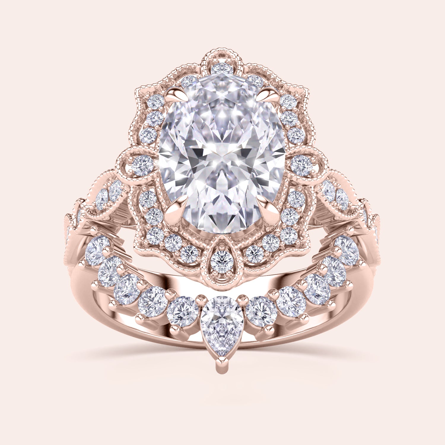 Detailed frontal view of oval halo diamond engagement ring set, highlighting exquisite craftsmanship and filigree accents in recycled rose gold |
#14KRecycledRoseGold #18KRecycledRoseGold
