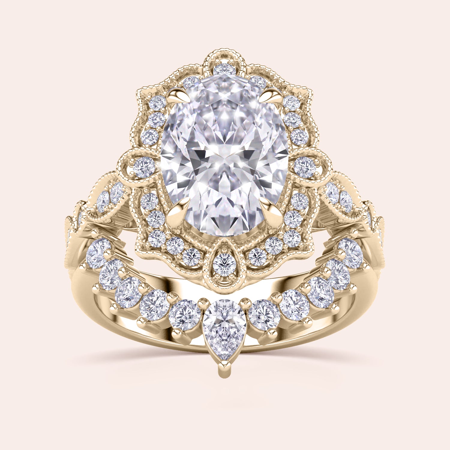 Detailed frontal view of oval halo diamond engagement ring set, highlighting exquisite craftsmanship and filigree accents in recycled yellow gold | 
#14KRecycledYellowGold #18KRecycledYellowGold