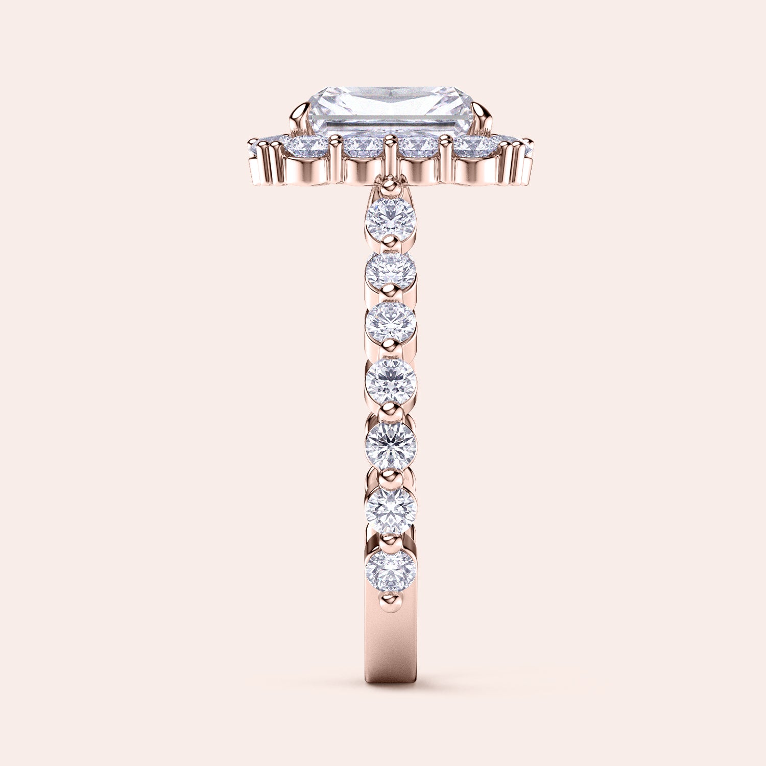 Side view of radiant-cut diamond halo engagement ring showcasing sparkling diamond band in rose gold | #14KRecycledRoseGold #18KRecycledRoseGold
