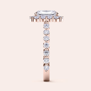 Side view of radiant-cut diamond halo engagement ring showcasing sparkling diamond band in rose gold 