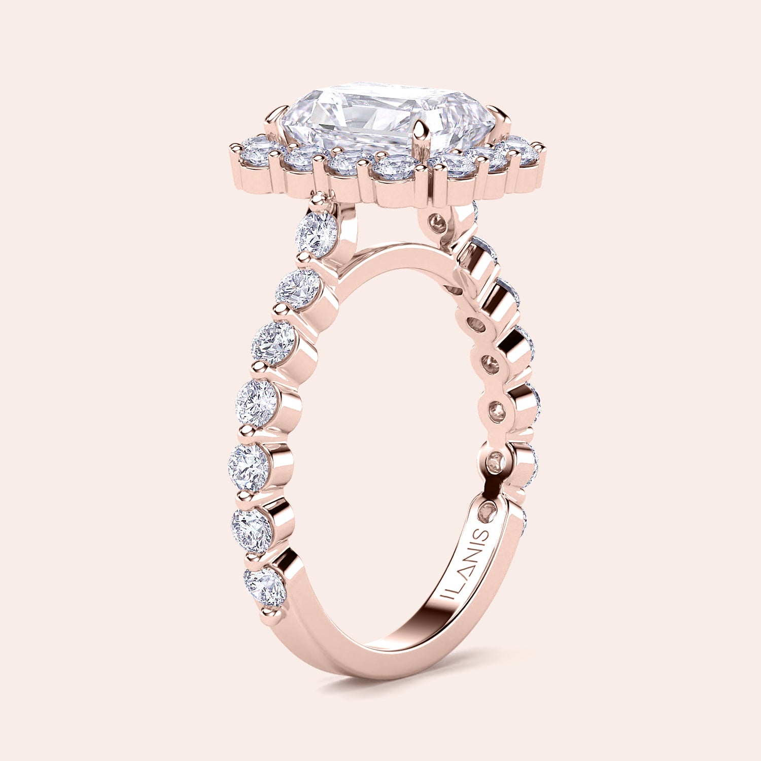 Angled view of radiant-cut halo diamond ring highlighting detailed diamond-studded band crafted in rose gold |

#14KRecycledRoseGold #18KRecycledRoseGold
