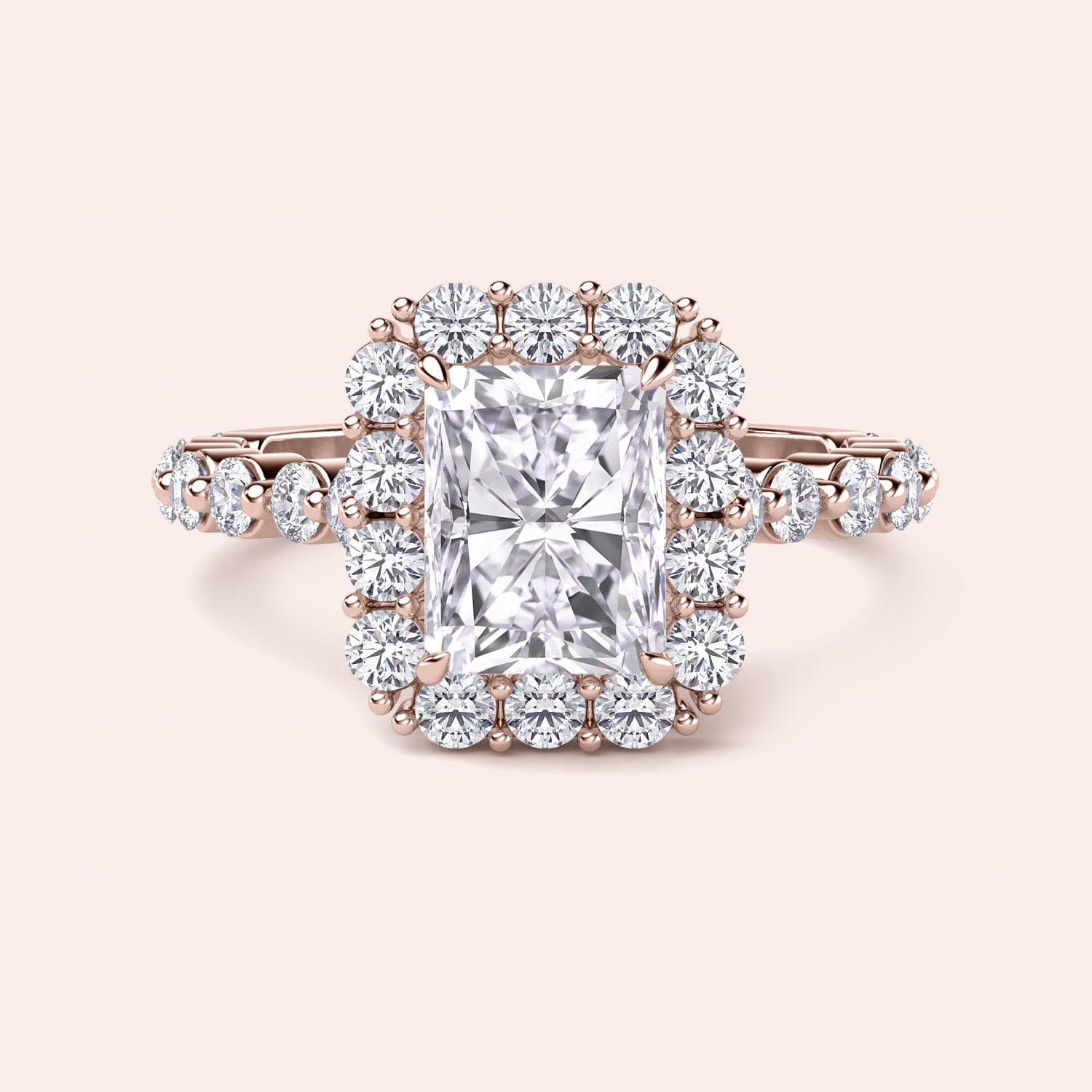 Front view of radiant-cut diamond halo engagement ring surrounded by brilliant diamonds in rose gold setting |

#14KRecycledRoseGold #18KRecycledRoseGold