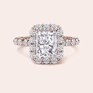Front view of radiant-cut diamond halo engagement ring surrounded by brilliant diamonds in rose gold setting 