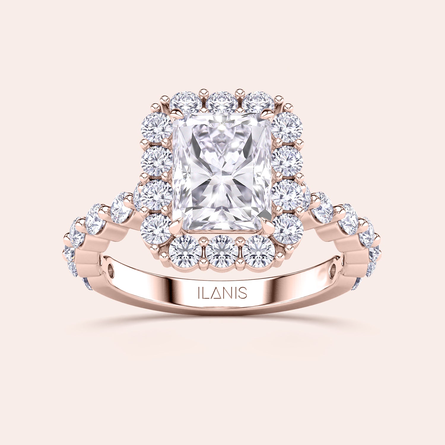 Detailed frontal close-up of radiant-cut halo diamond ring featuring a delicate diamond-accented band in rose gold | #14KRecycledRoseGold #18KRecycledRoseGold