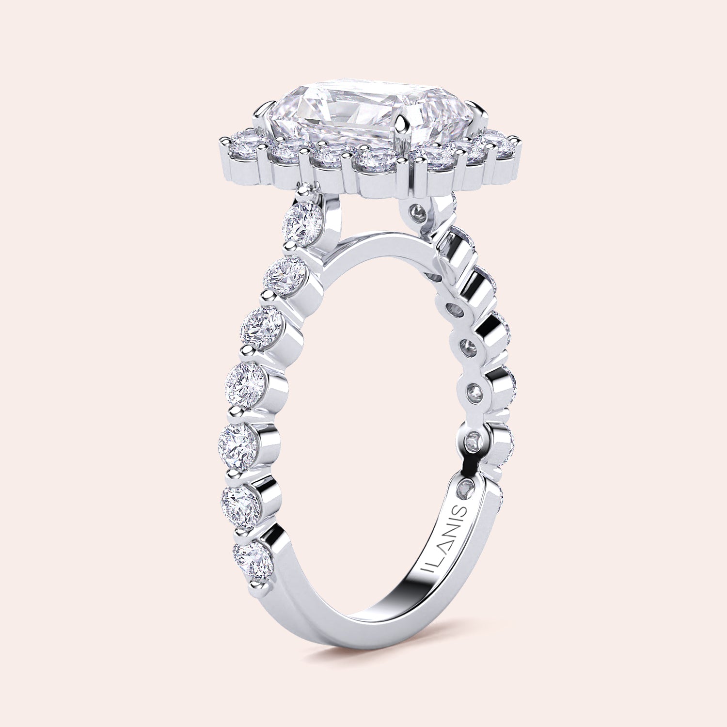 Angled view of radiant-cut halo diamond ring highlighting detailed diamond-studded band crafted in white gold or platinum | 

#14KRecycledWhiteGold #18KRecycledWhiteGold #Platinum
