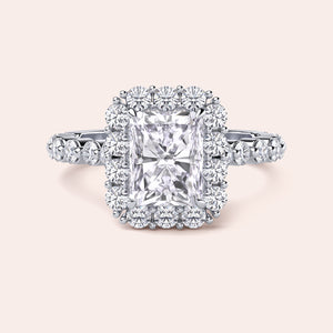 Front view of radiant-cut diamond halo engagement ring surrounded by brilliant diamonds in white gold or platinum setting 