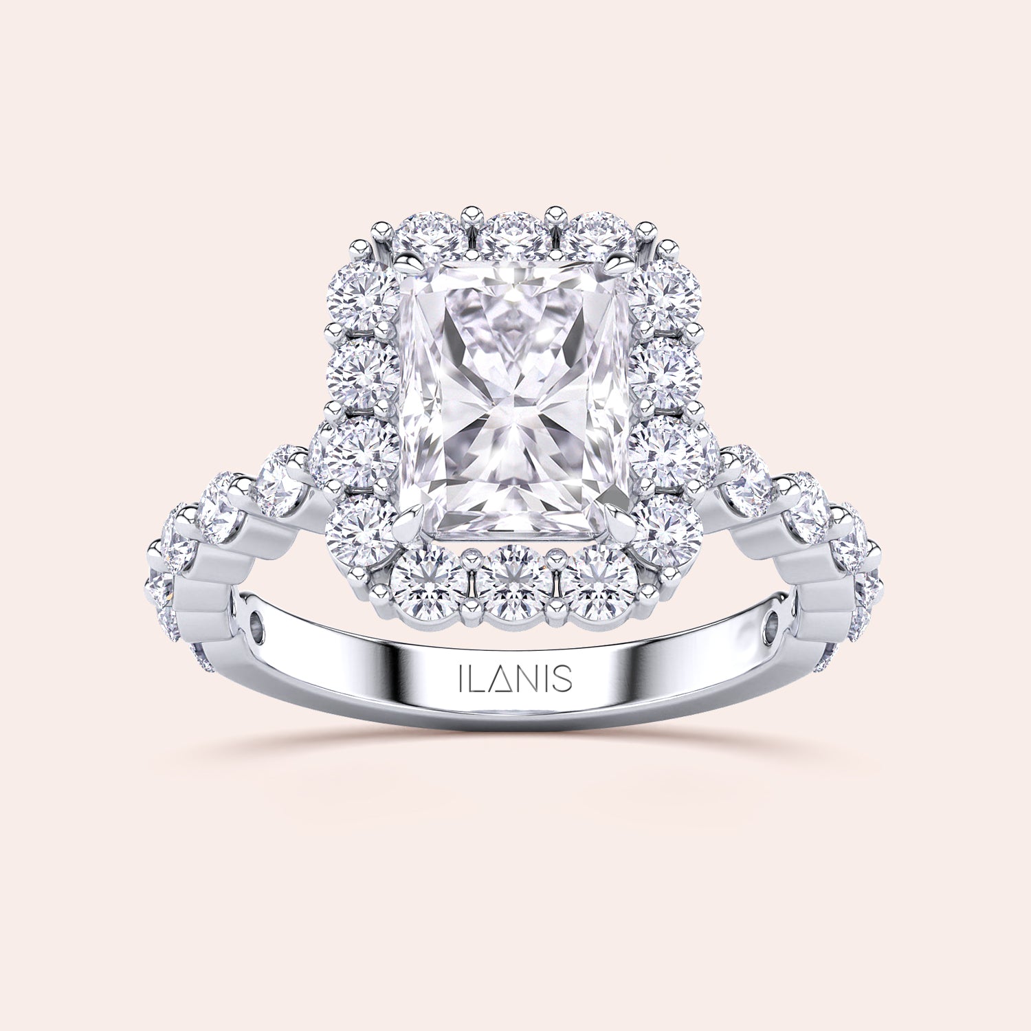 Detailed frontal close-up of radiant-cut halo diamond ring featuring a delicate diamond-accented band in white gold or platinum | #14KRecycledWhiteGold #18KRecycledWhiteGold #Platinum